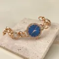 Damen Quarzarmbanduhr Roségold mit blauem Zifferblatt und funkelnden Strasssteinen Armband. - Blaues Zifferblatt / Roségold