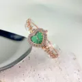 Elegante grüne Herz Quarzuhr mit funkelnden Strasssteinen und roségoldenem Blumenarmband - Grün