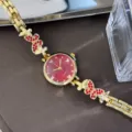 Goldene Damen Quarzarmbanduhr mit roten Kristall Schmetterling Armband und Zifferblatt. - Rot