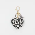 Leopard print heart keychain detail shot, featuring a stylish grey tassel and gold metal hardware. - White Tassel Keychain