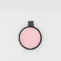 Detailed closeup of a cute pink and black leather smiley face keychain and bag pendant. - Smile Face Style / Pink