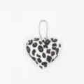 Close-up detail shot of the fluffy leopard print heart keychain pendant with metal chain. - White Bead Chain