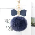 Dark blue faux fur pom pom keychain with leather bow and sparkling rhinestone decor. - 8cm Pompom / Navy Blue