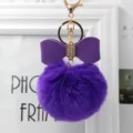 Purple faux fur pom pom keychain with leather bow and gold clasp for bags and keys. - 8cm Pompom / Purple
