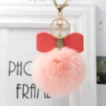Fluffy pink pom pom keychain with red leather bow and gold hardware for bags and keys. - 8cm Pompom / Pink