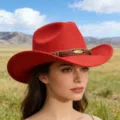 Red wool felt western cowboy hat featuring a beaded braided band and a stylish metal feather accent. - Red
