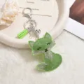 Green rhinestone fox keychain detailed view, featuring sparkling crystal stones and cute tassel pendant. - Fruit Green