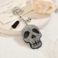 Rhinestone skull keychain with black tassel and bell, stylish hip-hop bag pendant accessory. - Black
