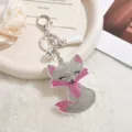 Sparkly rhinestone pink fox keychain with tassel and bell for cute bag charm and chic accessory. - White