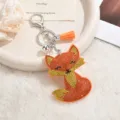 Sparkling rhinestone fox keychain with orange tassel, cute metal bag charm accessory pendant. - Orange