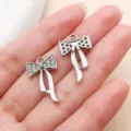 Silver bow charm pendant with rhinestones, DIY jewelry accessory for bracelet and necklace. - Streamer Rhinestone Bowknot (27092) / 1 Piece (23x14mm) / Silver