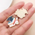 Graduation season enamel metal charms, doctor hat book pendant for DIY jewelry making crafts. - Navy Cap Book Paper Style (18793)
