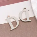 Κρεμαστό γράμμα D από ανοξείδωτο χάλυβα για DIY κοσμήματα, λεία επιφάνεια, ανθεκτικό. - Μενταγιόν Κεφαλαίο Γράμμα D (T2195-D) / 1 Τεμάχιο (12x9x1mm) / Χρώμα Ατσαλιού