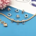 Detail shot of silver DIY bail beads and charm connectors for custom charm bracelets. - Style 8914 (6*10mm)