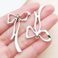 Silver hollow bow ribbon zinc alloy pendant charm for DIY bracelet keychain jewelry making accessories. - Large Ribbon Bow-knot Style (19435) / 1 Piece (45x26mm) / Antique Silver