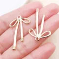 Gold Tone Hollow Bow Ribbon Metal DIY Pendant Charm Jewelry Accessories Variant Style A - Hollow Bow-knot Style (22864) / 1 Piece/Pack (32x19mm) / KC Gold