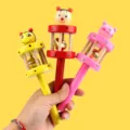 Wooden baby rattle toy with cartoon animal heads and built-in bell, colorful grasping toy for infants. - Middle Rattle