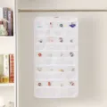 Detail view of double-sided hanging jewelry organizer with clear pockets for earrings and rings - White