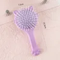 Vue détaillée de la brosse à coussin d'air chat mignon avec une taille compacte et douce. - Peigne à coussin d'air / Emballage en vrac / Violet