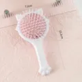 Vue détaillée de la brosse à cheveux coussin d'air chat mignon, outil rose portable. - Peigne à coussin d'air / Emballage en vrac / Blanc