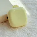 Mini brosse à cheveux pliante portable avec coussin d'air en jaune pâle, design compact. - Peigne à Coussin d'Air Carré / Sac OPP / Jaune