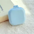 Mini draagbare opvouwbare kussen haarborstel in lichtblauwe snoepkleur, compact reistool. - Blauw