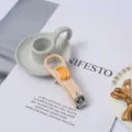 Cute portable folding nail clipper with banana decor, cartoon creative manicure tool for daily use. - Banana