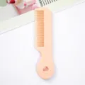 Peach pink mini portable hair comb for girls and kids, cute heart hollow design daily use. - Light Orange