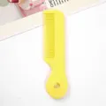 Candy color mini portable hair comb, cute heart shaped handle, perfect for kids and daily use. - Individual Packaging / Yellow