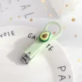 Cute foldable nail clipper with green avocado design, portable mini manicure tool for daily use. - Avocado