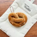 Cute cartoon food plush toy keychain, brown soft doll pendant for backpack and keys. - Pretzel Charm