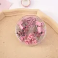 Pink office stationery set with binder clips, paper clips and push pins in a round box. - Combination Set - Pink