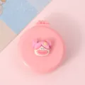 Petite brosse à cheveux pliante rose portable avec joli visage de poupée et miroir intégré. - Poupée à grande bouche avec couettes