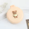 Spazzola per capelli pieghevole con cuscino d'aria e specchio, mini pettine da massaggio. - Spazzola pneumatica orsetto giallo crema