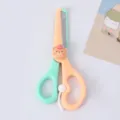 Kids safety scissors with cute cartoon bear design, orange and green color, DIY craft. - Apple Bear