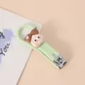 Süßer Cartoon Puppen Klapp-Nagelknipser für Kinder, grünes Mini-Maniküre-Werkzeug. - Mädchen mit Dutt