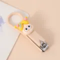 Niedlicher faltbarer Nagelknipser im Cartoon-Anime-Mädchen-Stil mit Puppen-Dekor beige. - Gelbhaariges Mädchen