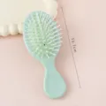 Mini brosse à cheveux portable avec coussin d'air, peigne de voyage vert menthe mignon pour tous. - Brosse pneumatique vert clair
