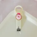Cream style cute portable nail clipper with pink donut and bow charm for daily home use. - Cream Style - Donut