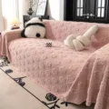Pink plush sofa cover with cute paw print design, soft and cozy furry couch towel blanket. - Pink
