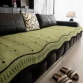 Detail shot of green chenille sofa cushion with wave pattern in luxury living room setup. - 70*70 / Green
