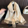 Detail view of lightweight long stripe scarf, soft sheer fabric elegant beach shawl. - Beige