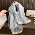 Elegant grey chiffon silk scarf featuring sparkling rhinestone and pearl floral details. - Gray