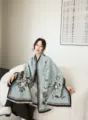 Detailed view of winter warm jacquard reversible shawl, elegant floral pattern design. - Blue Deer & Flowers Pattern