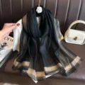 Black and gold striped faux silk scarf, elegant long shawl for women, chic fashion accessory. - Black