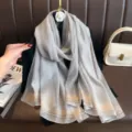 Detailed close-up of a shimmering gray long scarf with metallic stripes, elegant. - Gray