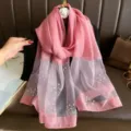 Details of pink long scarf featuring delicate pearl and rhinestone floral embellishments. - Deep Pink