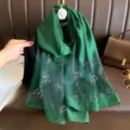 Green polyester long scarf featuring elegant rhinestone clover and pearl details for women. - Green