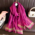 Detail shot of elegant magenta shimmering long silk scarf with stylish border stripes for women. - Rose Red