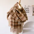 Detailed view of a retro plaid fringed scarf with woven brand label, soft autumn winter texture. - Brown Fringed Plaid / 195*65cm